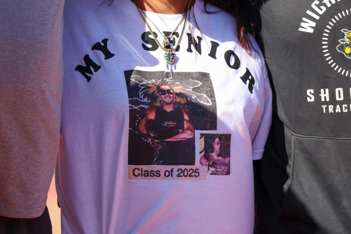 A fan wears a senior sprinter and hurdler Jaleel Montgomery shirt. Montgomery won the men's 4x100 meter relay and men's 100 meter sprint on May 9.