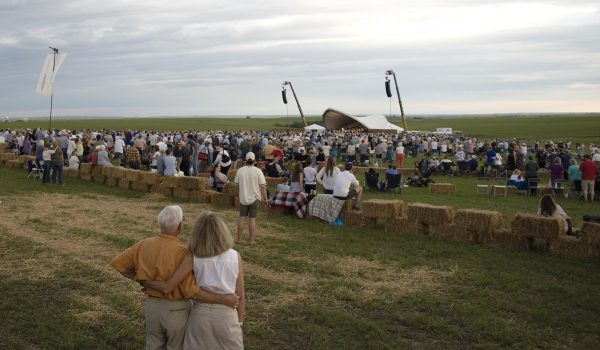 The large crowd standing as “Home on the Range” is played by the Kansas City Symphony. It is tradition to stand, take your friends and family arm-in-arm and sway to the music during “Home on the Range.” 
/ Flint Hills Media Project