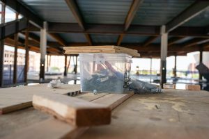 Plywood sits on a box of screws in the construction site of a new combined biomedical campus. The campus will combine program from WSU’s College of Health Professions, WSU Tech and KU and is expected to be fully operation in the summer of 2027.