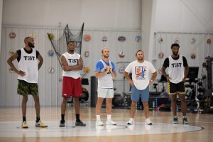 Former Wichita State and current AfterShocks players line up at half-court to watch the rest of their team practice on July 15. The TBT is a 64-team tournament with a grand prize of $1 million.