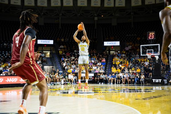 AfterShocks guard Nike Sibande shoots a 3-pointer against Challenge ALS on July 21. Sibande shot 5-of-6 from outside the arc in the 85-68 win.