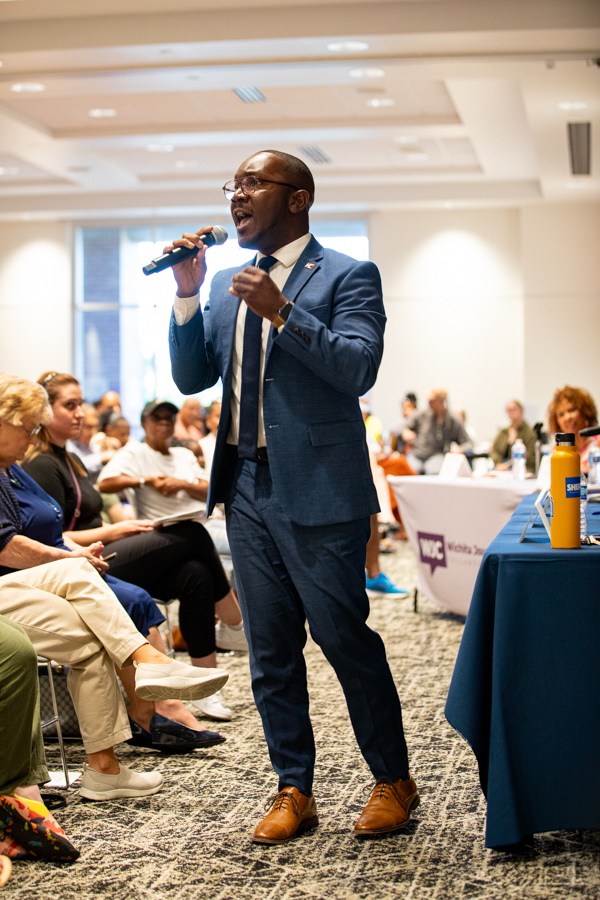Joseph Shepard walks up to the crowd to begin his opening remarks at the District One City Council Candidate forum on July 15. Shepard will run in the City Council primary election on Aug. 5.