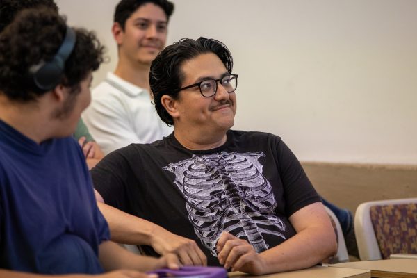 Justin Favela smiles as he gets introduced to the audience on July 31. Favela is a Las Vagas born artist.