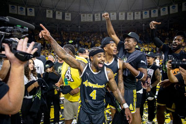AfterShocks guard Marcus Keene points to the TBT bracket asking to celebrate the AfterShocks championship game win on Aug. 3. The AfterShocks had never played in the TBT championship.