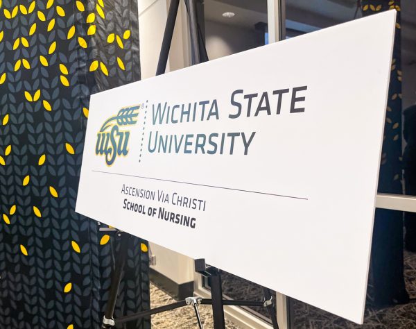 A nameplate displays the new logo of the Wichita State Ascension Via Christi School of Nursing. The change was announced Thursday, Aug. 28.