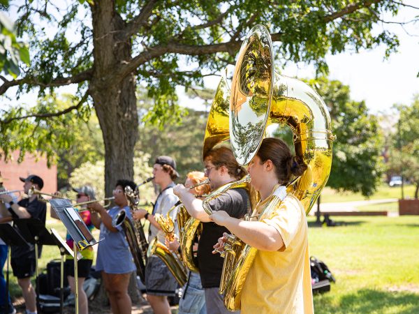 Junior Elise Collins plays her sousaphone alongside the Shocker Sound band. Camp was free to attend for Shocker Sound band members.