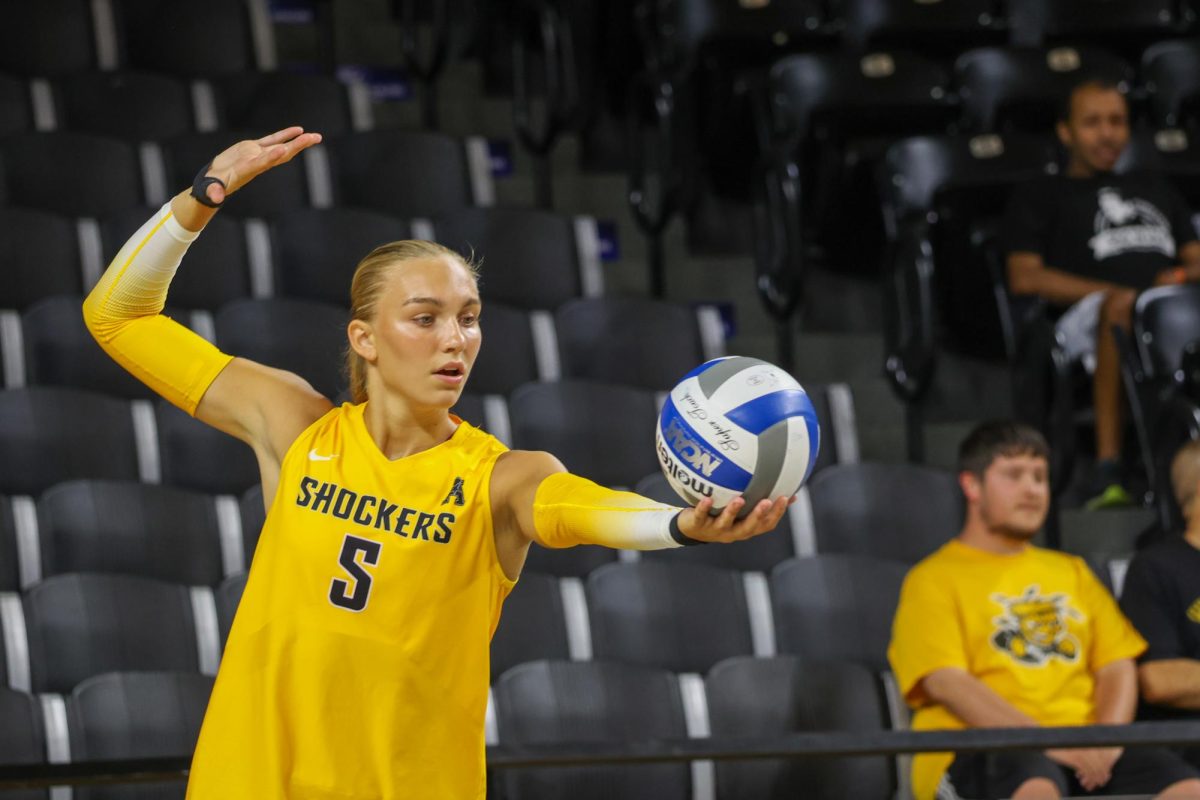 Redshirt freshman setter Sarah Musial prepares to serve the ball during the Black and Yellow scrimmage. The Yellow team lost on Aug. 23, 4-1.
