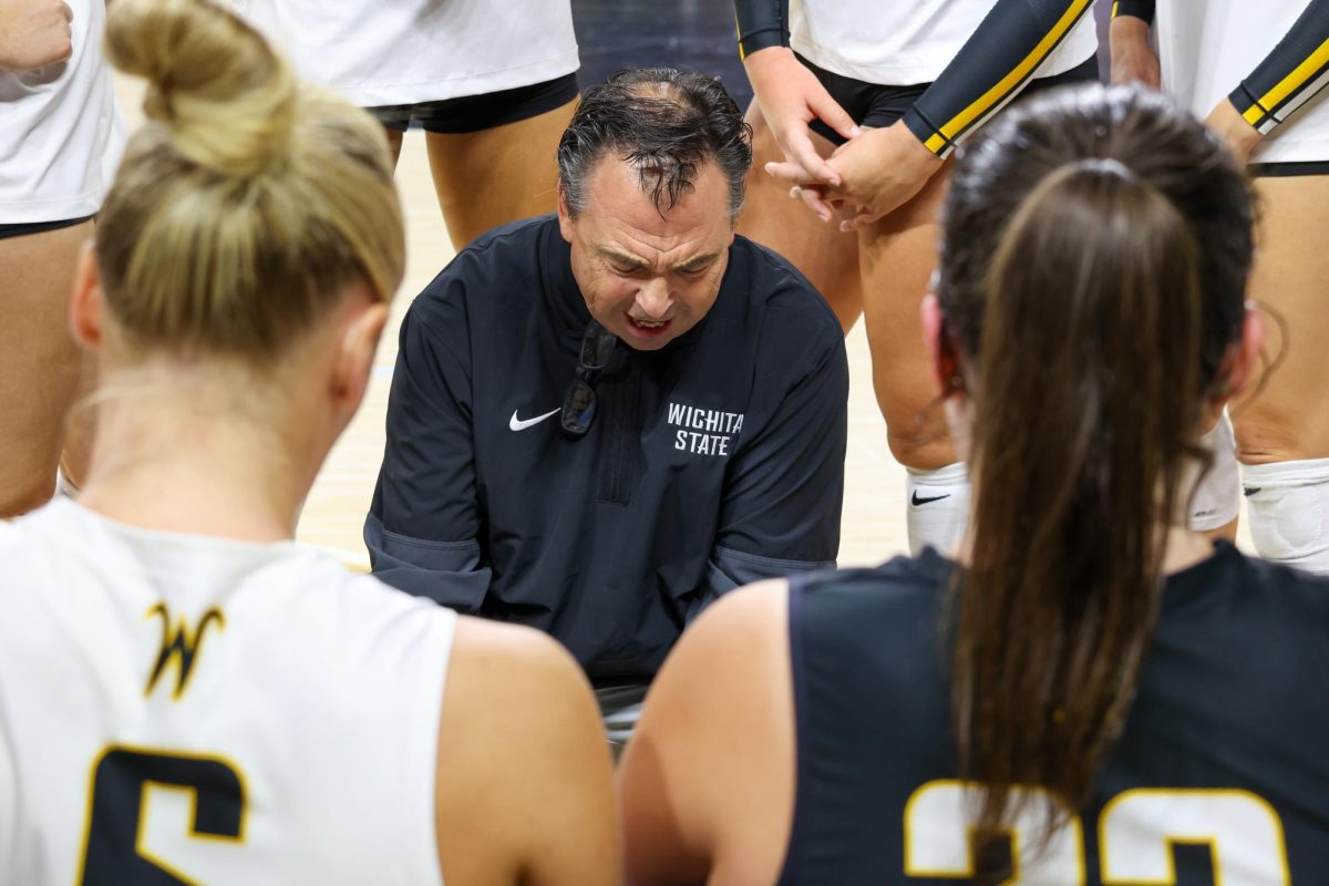 WSU head volleyball coach Chris Lamb talks to his player in between sets on Aug 31. Lamb is 527-251 as the Shockers' head coach.