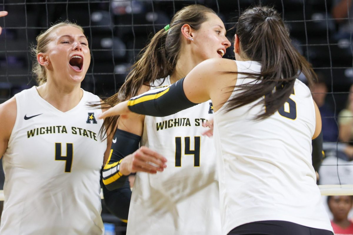 The Shockers celebrate after scoring a point against Arkansas. The Shockers beat the Razorbacks, 3-2, on Aug. 31.