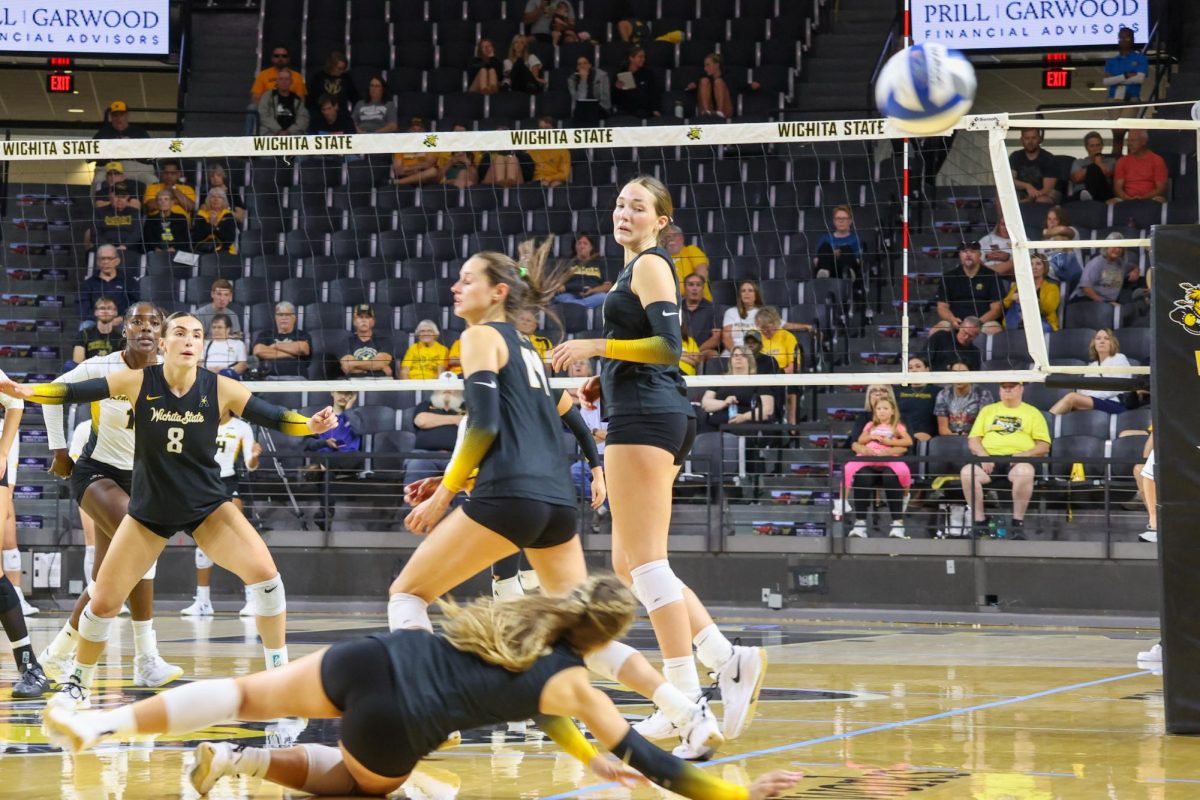 Sophomore libero Grace Hett tries to save the ball from hitting the ground on Aug. 29. Hett was unsuccessful on her diving attempt.