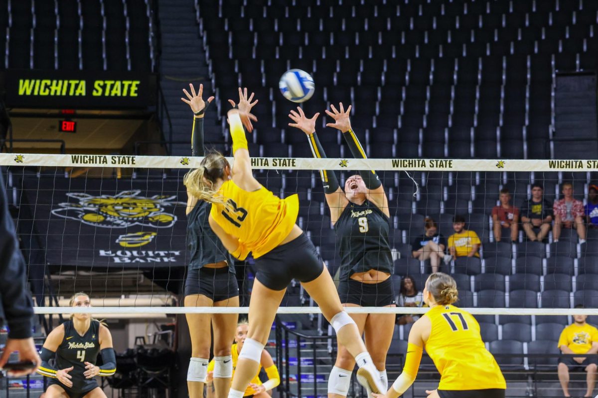 Senior outside hitter Emerson Wilford tries to get the ball over the net on Aug. 23. Last year, Wilford had 252 kills in 31 matches.