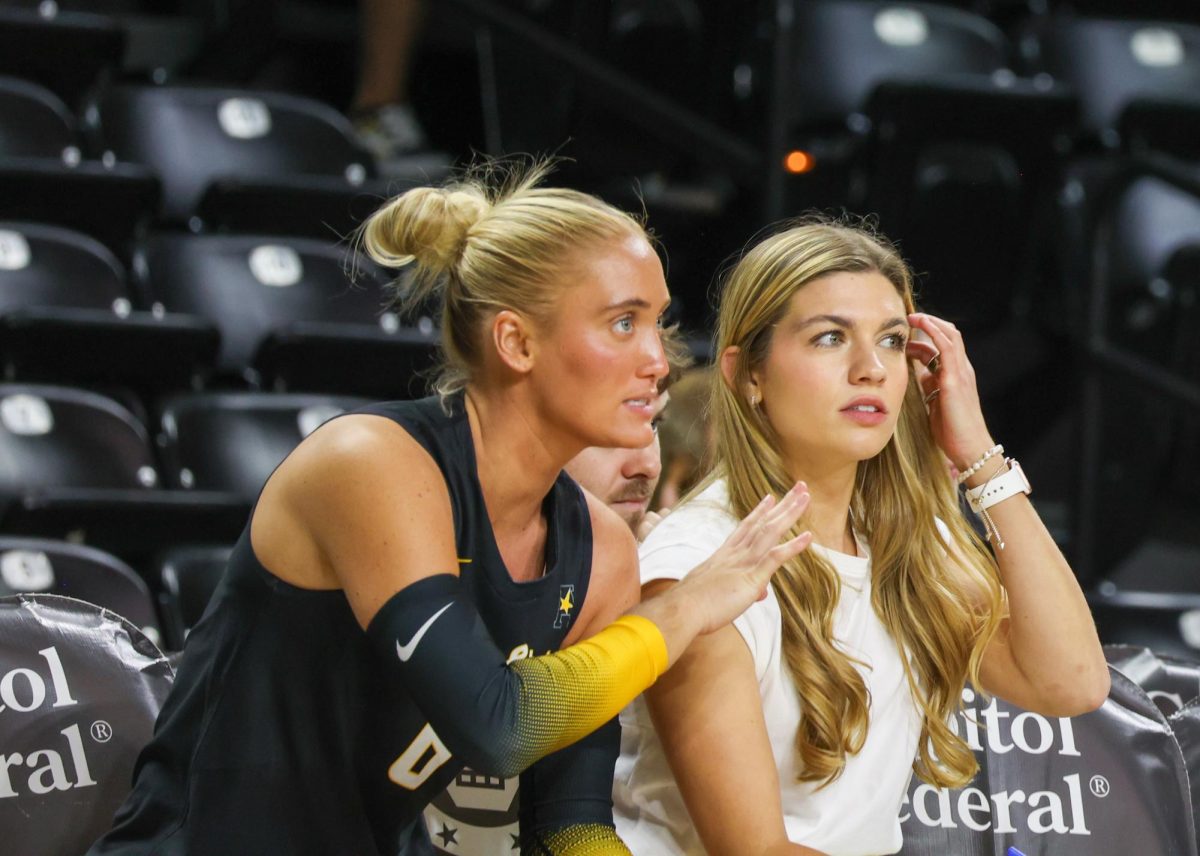 Senior libero Katie Galligan talks with graduate assistant coach Annalie Heliste during a pause in play on Aug. 29. Galligan made eight digs in the loss to Kennesaw State.