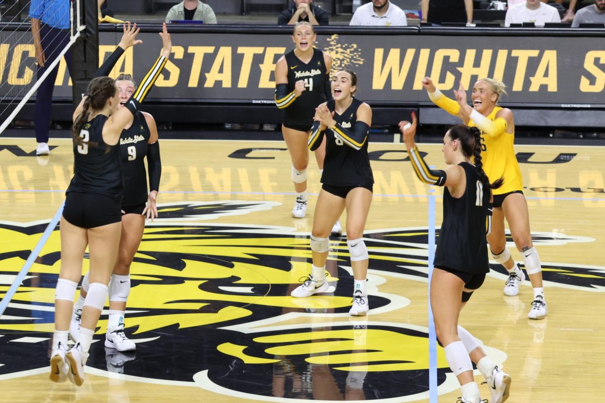 The Black team congratulates freshmen outside hitter Olivia Cohee after a kill on Aug. 23. Cohee is one of nine true freshmen on the roster.