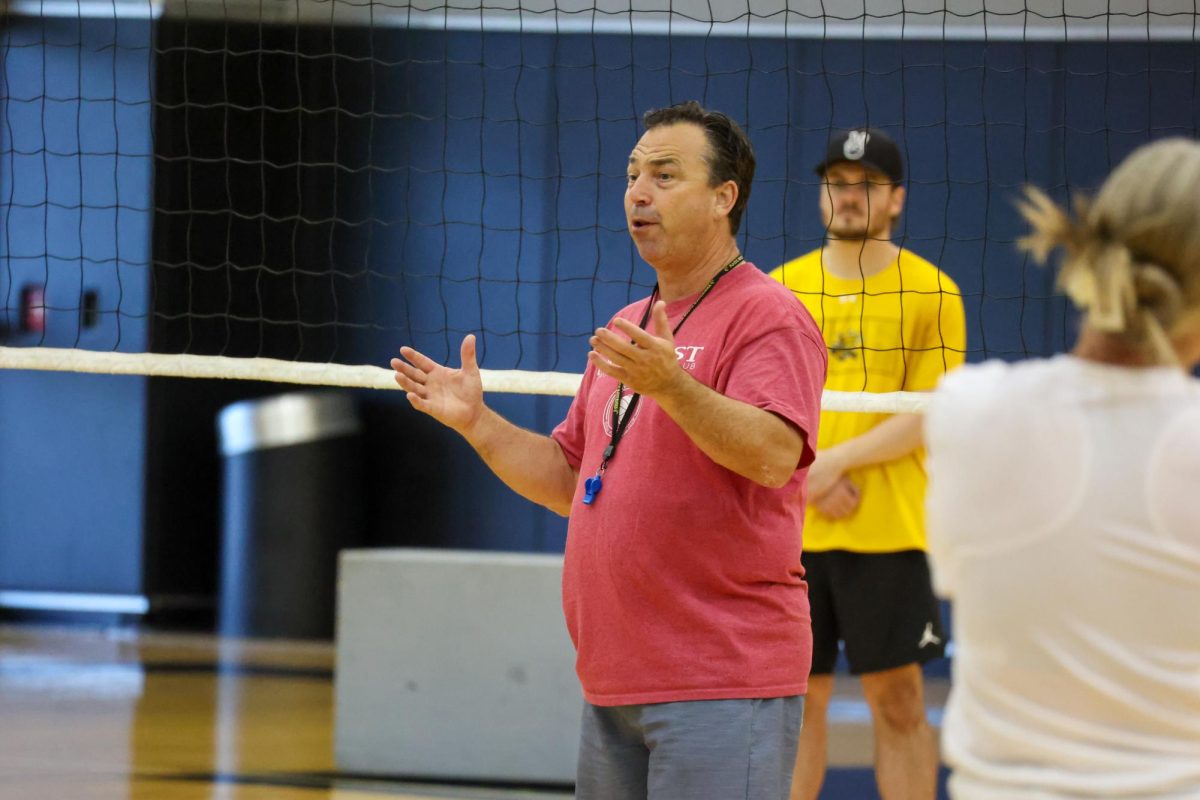 Wichita State volleyball head coach Chris Lamb talks to his team at the start of the team's first practice this season on Aug. 4. The Shockers' regular season will start Aug. 29 against Kennesaw State.