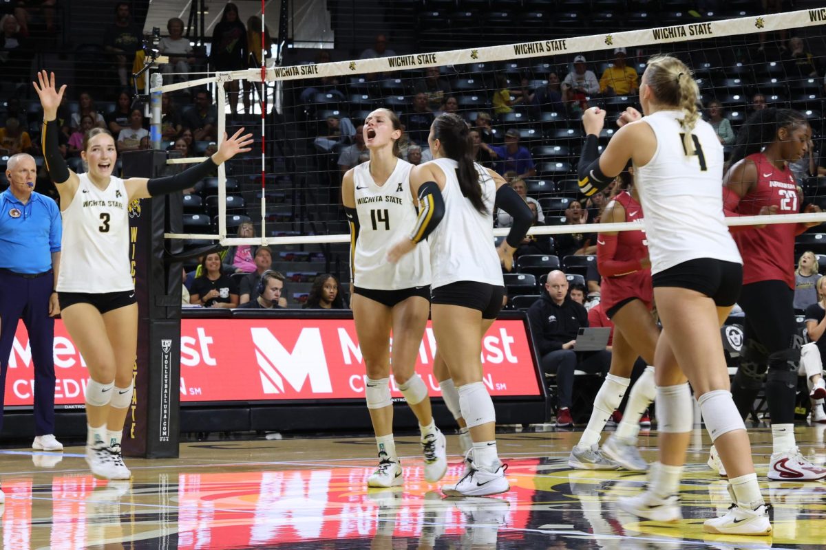 Wichita State celebrates after junior middle blocker Maddie Wilson gets a kills against Arkansas. Wilson had nine kills in the 3-2 win on Aug. 31.