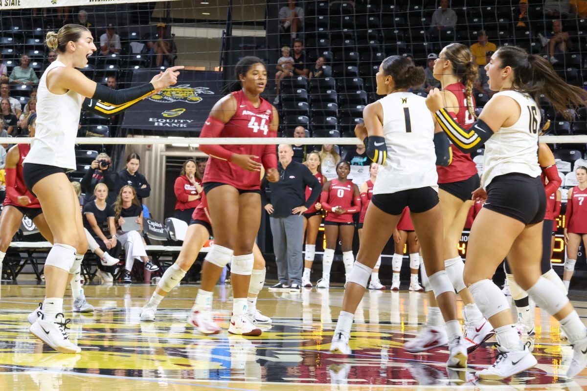 Senior outside hitter Emerson Wilford points and screams at freshmen middle blocker Janaya Weitkemper after she got a kill against Arkansas. Weitkemper recorded her first collegiate kill in the win on Aug. 31.