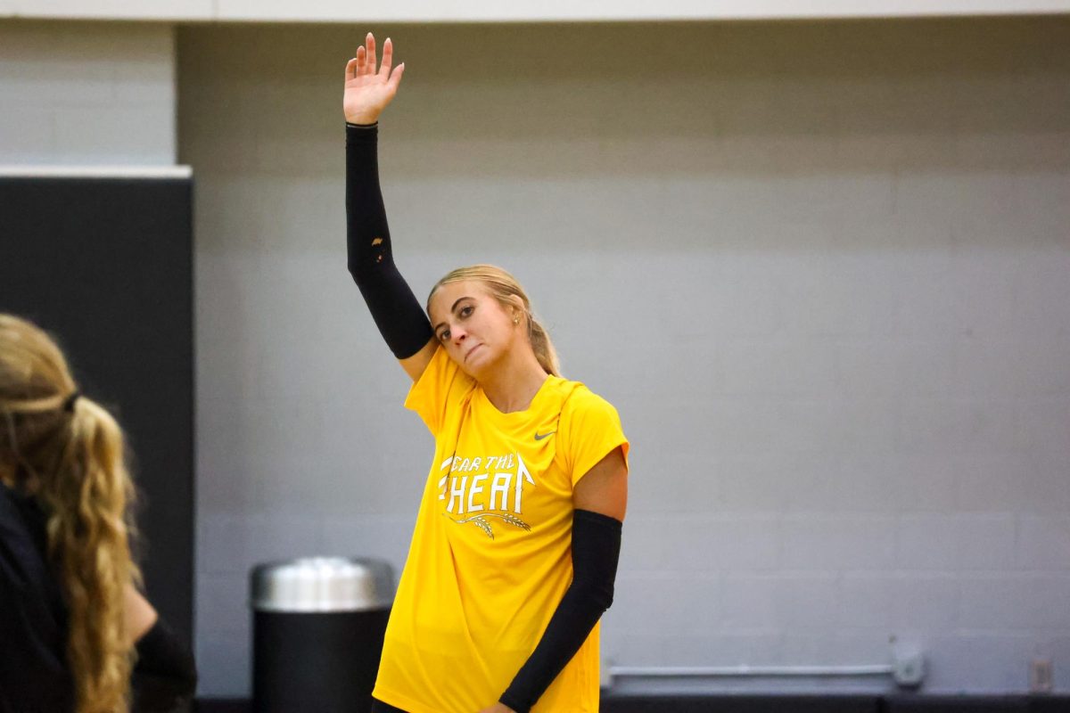 Sophomore outside hitter Gracie Morrow raises her hand to ask a question on Aug. 4. Morrow appeared in 17 matches last season during her freshman year.