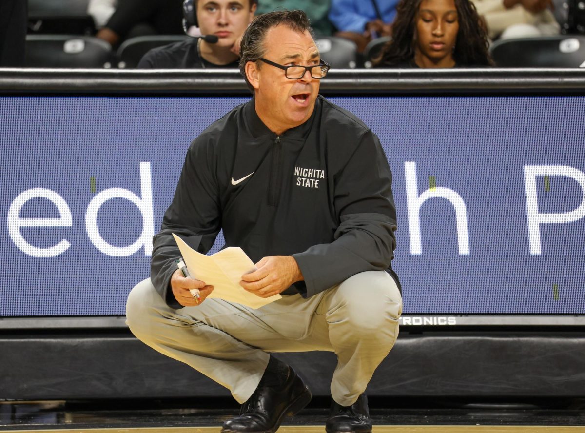 WSU head volleyball coach Chris Lamb yells to his players on Aug. 31. Lamb is in his 26th year as the Shockers' head coach.