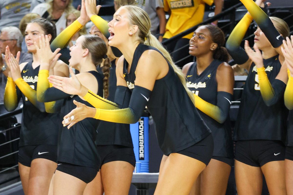 Sophomore middle blocker Allie Paulsen cheers on her teammates from the sideline. Paulsen made her first career start in the game against Kennesaw State on Aug. 29.
