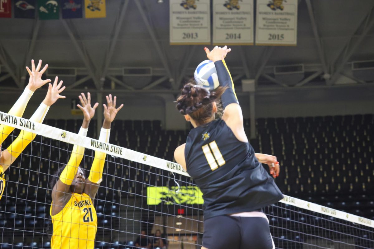 Junior outside hitter Sydney Dunning spikes the ball during the Black and Yellow scrimmage. The Black team beat the Yellow team, 4-1