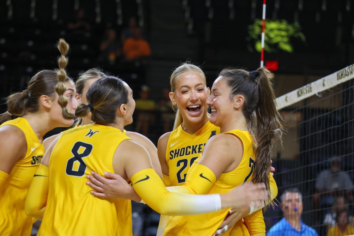 Sophomore outside hitter Nadia Wasilewski celebrates with her teammates after a kill on Aug. 23. The Yellow team lost to the Black team, 4-1.