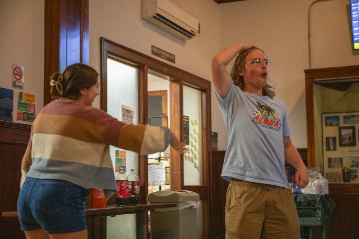 Sophomore Nick Dreier refuses to shake hands with his cornhole opponent after winning. In addition to cornhole, the picnic also featured various improv games.