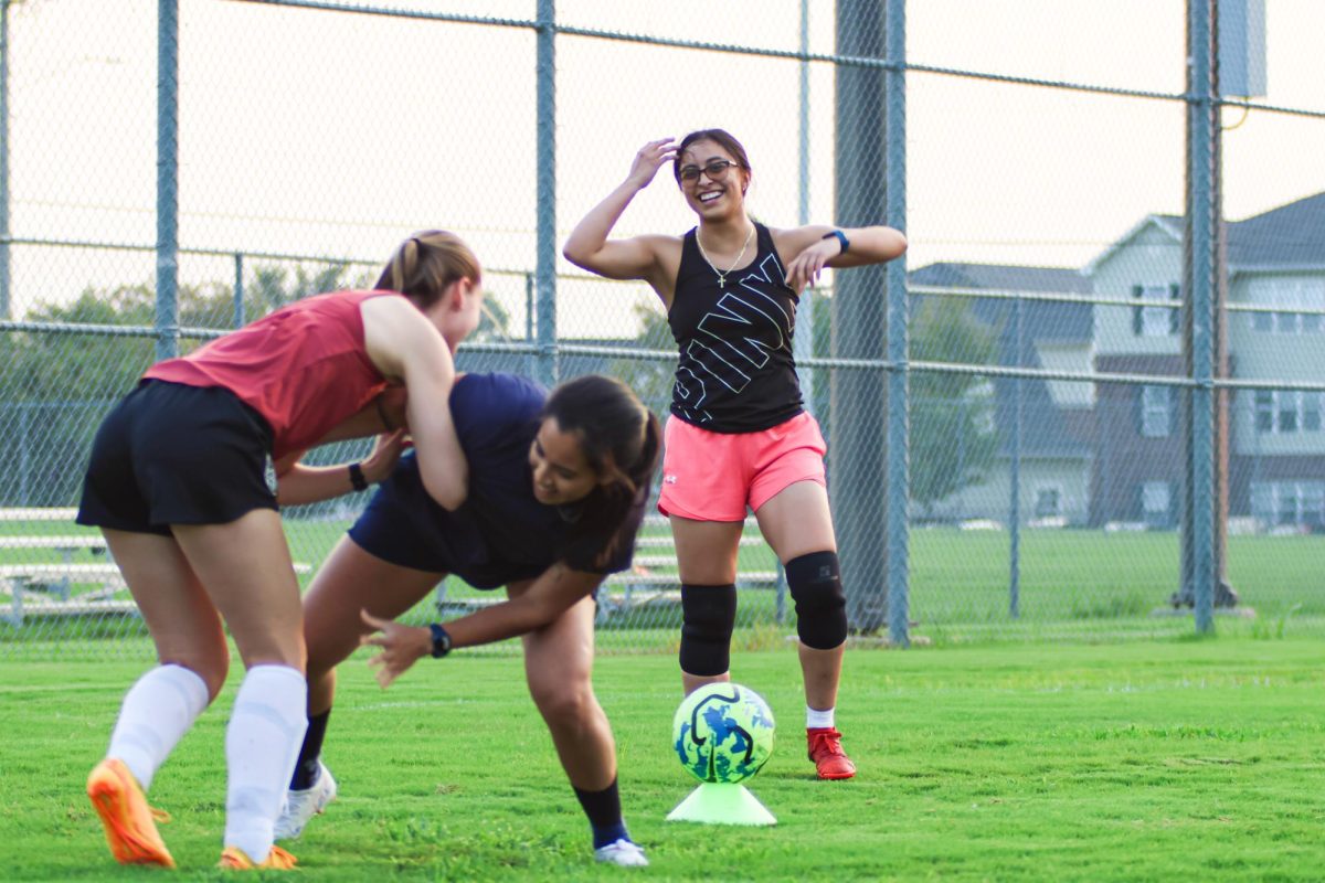 Members of Wichita State's women's soccer club warm up during practice on Sept. 4. Practices are every Tuesday and Thursday from 7-8:30 p.m.