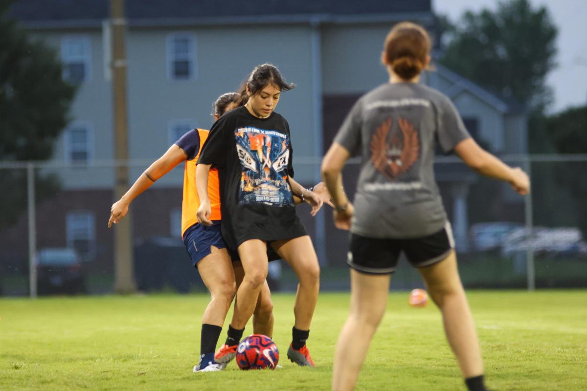 Angeles Perez attempts to take control of the ball from Christina Horta during women's soccer practice on Sept. 4. The women's soccer club practices at the Metroplex every Tuesday and Thursday.