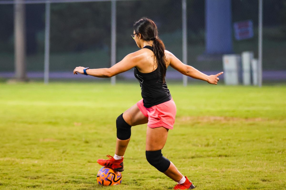 A Wichita State student traps the ball during women's soccer club practice on Sept. 4. 