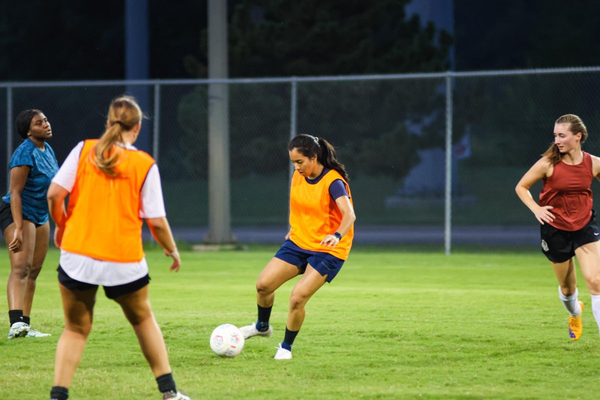 Wichita State student Angeles Perez passes the ball during practice on Sept. 4. The women's soccer club is an opportunity for students with varied skill levels to play competitively.