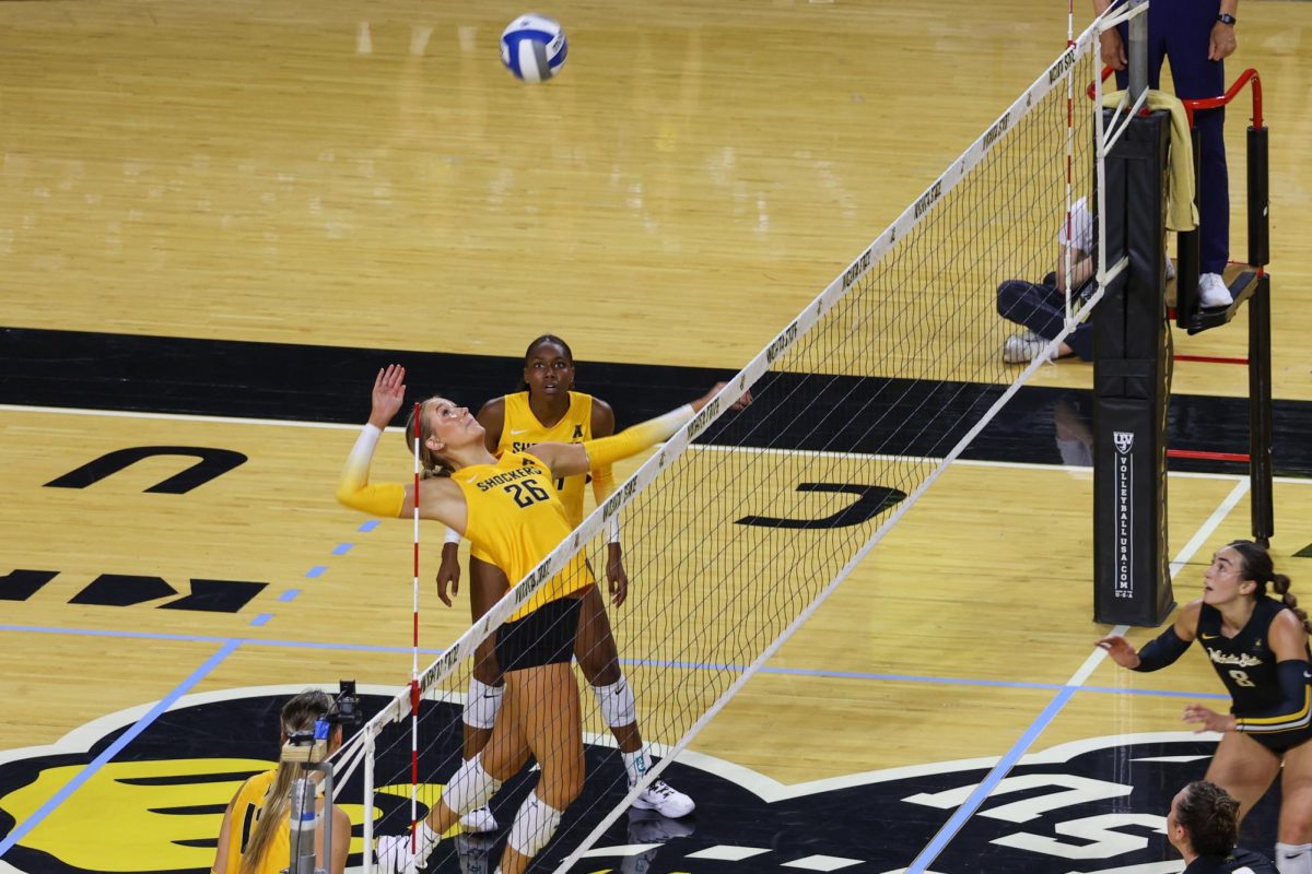 Redshirt sophomore Allie Paulsen jumps to spike the ball during Wichita State's Black and Yellow scrimmage on Aug. 23. Paulsen, a Wichita native, graduated from Andover Central High School.