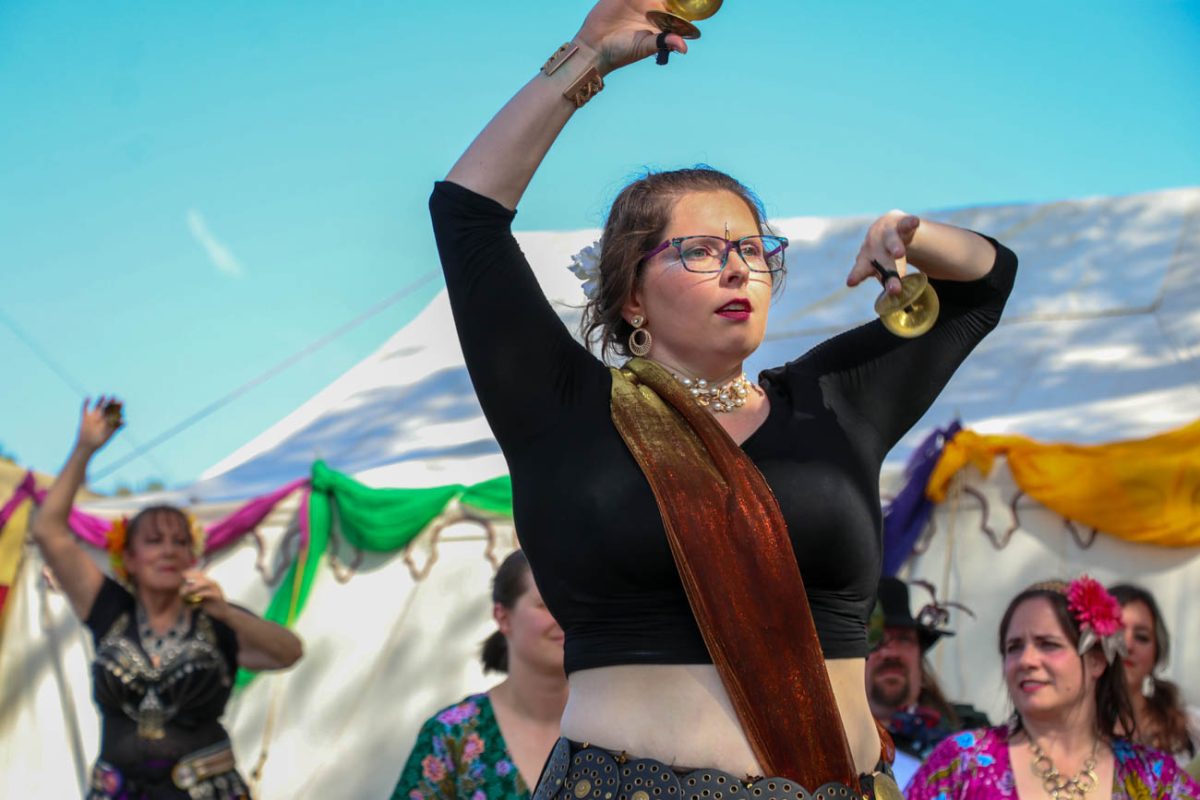 Performers with Amira Dance Productions dance with cymbals. The group specializes in belly dance.