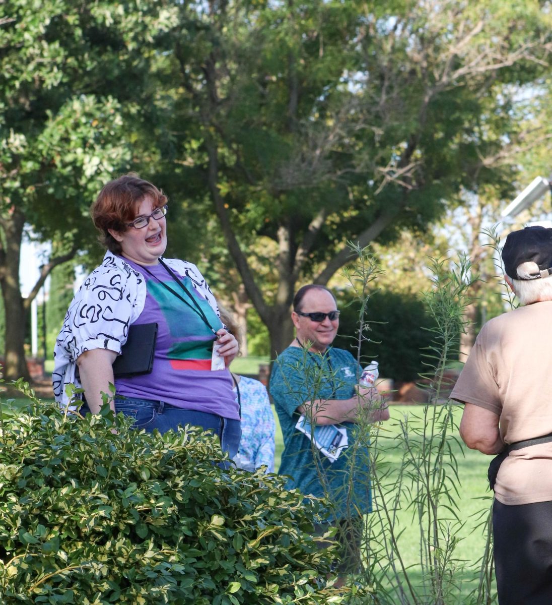 Student and tour guide Abigail Dehaven laughs while answering questions during WIchita State's semi-annual walking tour. Dehaven is currently working on their museum certificate.