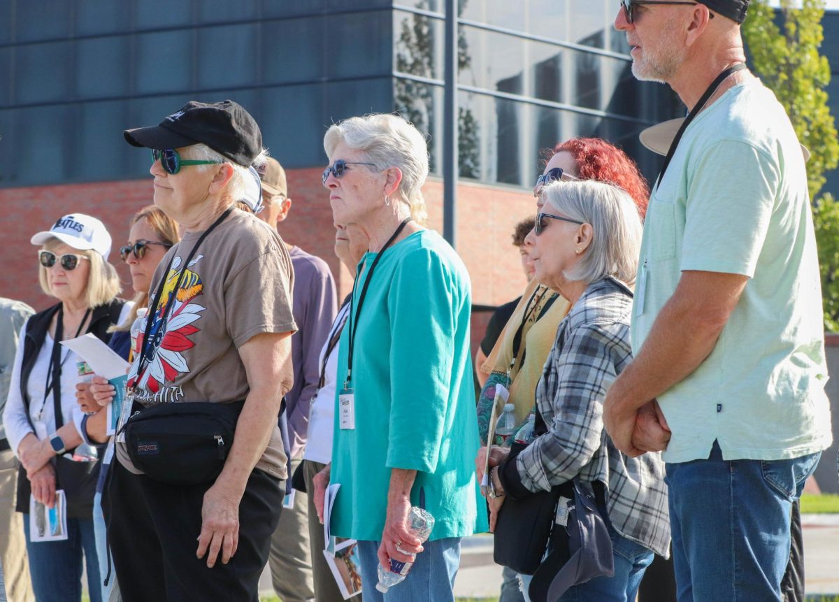 Participants of Wichita State's walking tour learn about the history of Cessna Stadium. The tour took place on Sept. 27.
