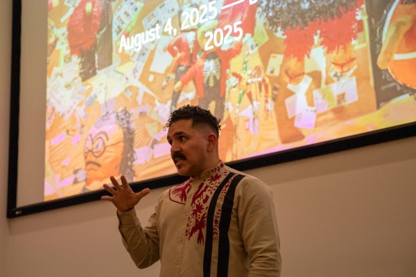 Emmanuel Ortega talks about art hisotry and Justin Favela’s career on Sept. 12. Favela's art is currently in exhibition at the Ulrich Museum of Art.