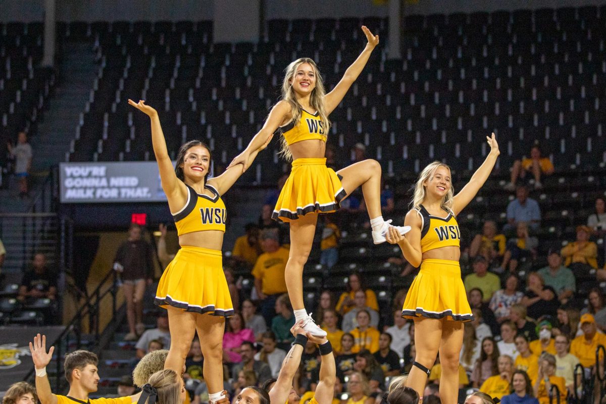 Wichita State's cheer team performs during timeout on Sept. 16. Wichita State lost to No. 17 Kansas, 3-0.