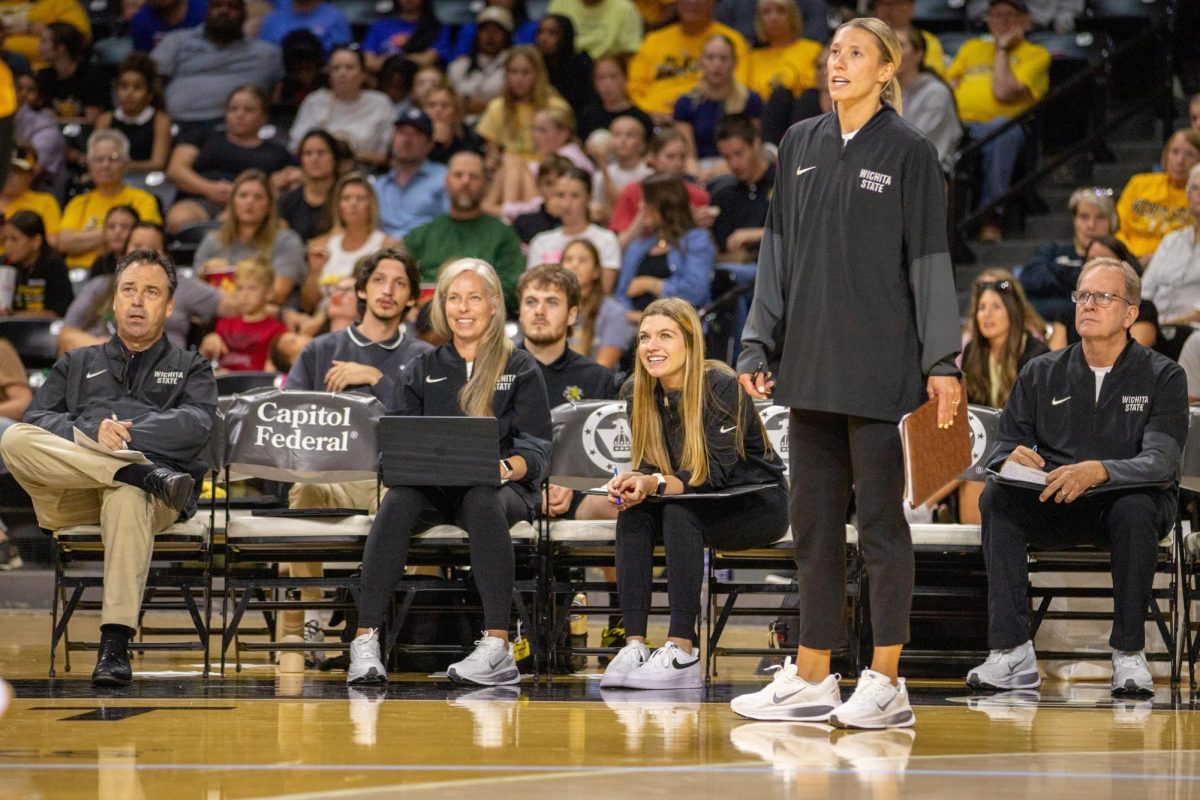 Wichita State volleyball's coaching staff looks on as the Shockers play against No. 17 Kansas. Wichita State lost Sept. 16, 3-0.