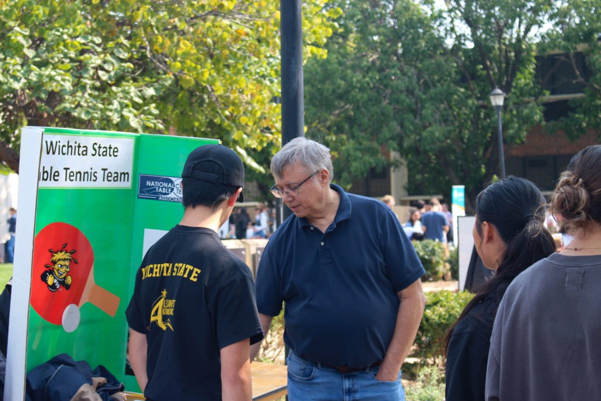 The Wichita State Table Tennis Team members table for potential members at Involvement Fair hosted by Student Engagement and Belonging. The event is hosted yearly and presents an opportunity for students to see what different student organizations offer. 