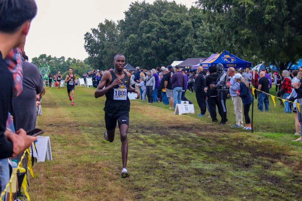 Elkana Kipruto crosses the finish line at the JK Gold Classic on Sept. 6. Kipruto won the individual title in the men's 6-kilometer race with a time of 18:41.49.