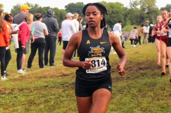 Sarah Bertry runs the women's 5-kilometer at the JK Gold Classic on Sept. 6 in Wichita State's new Nike uniform. The Shockers' partnership with Nike began July 1, 2025.