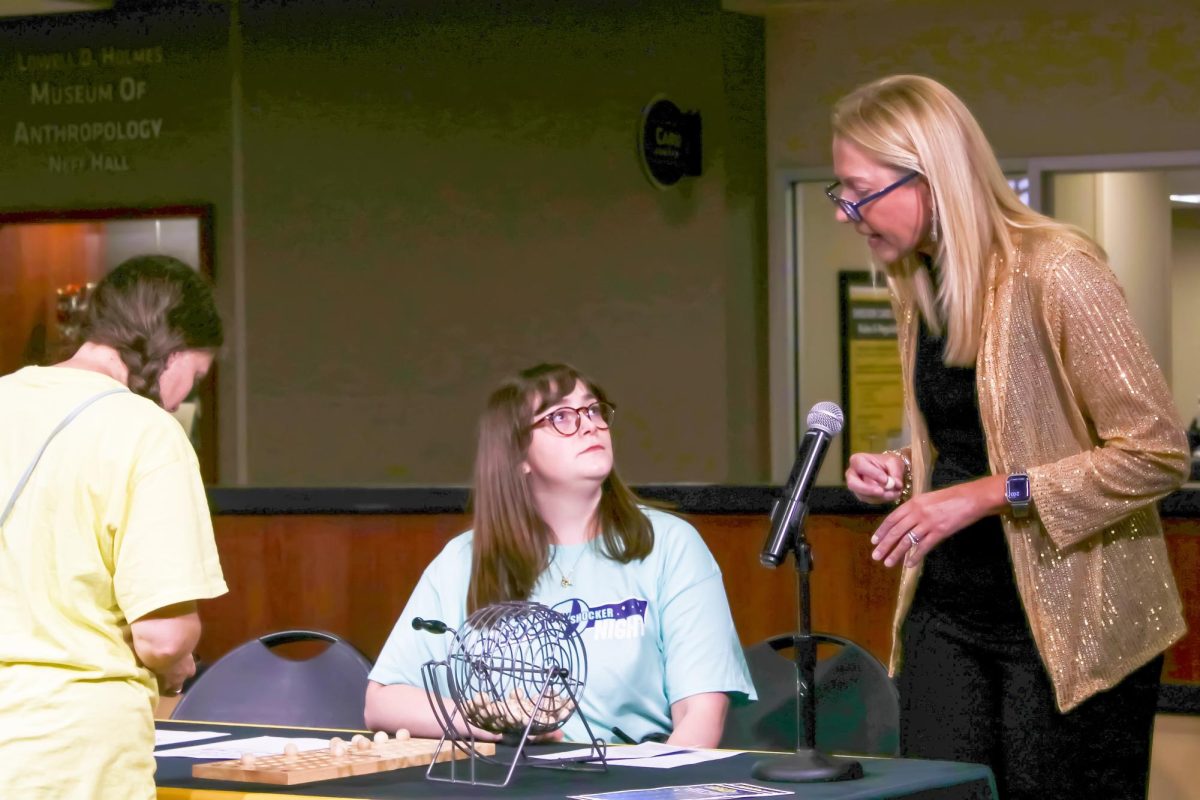 Lisa Tilma the director of the Shocker Store calls out BINGO numbers in the RSC Starbucks. Various offices in the RSC worked together at the RSC Day Shocker Night on Aug. 21.