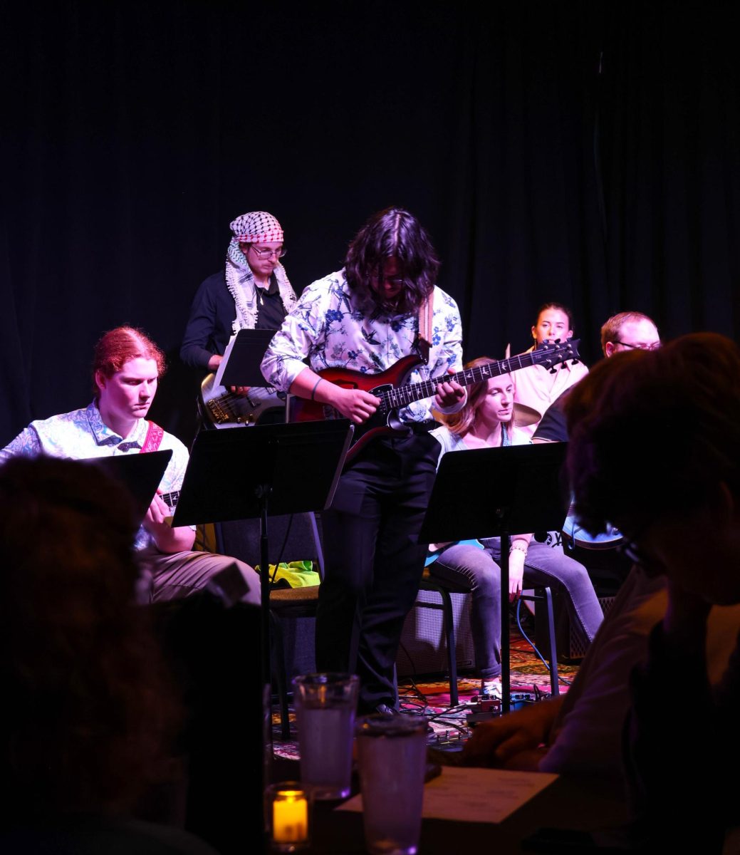 Wichita State student Adrian Torres plays a solo during a Guitar Ensemble set. Torres played guitar for both Guitar and Latin Jazz Ensembles.