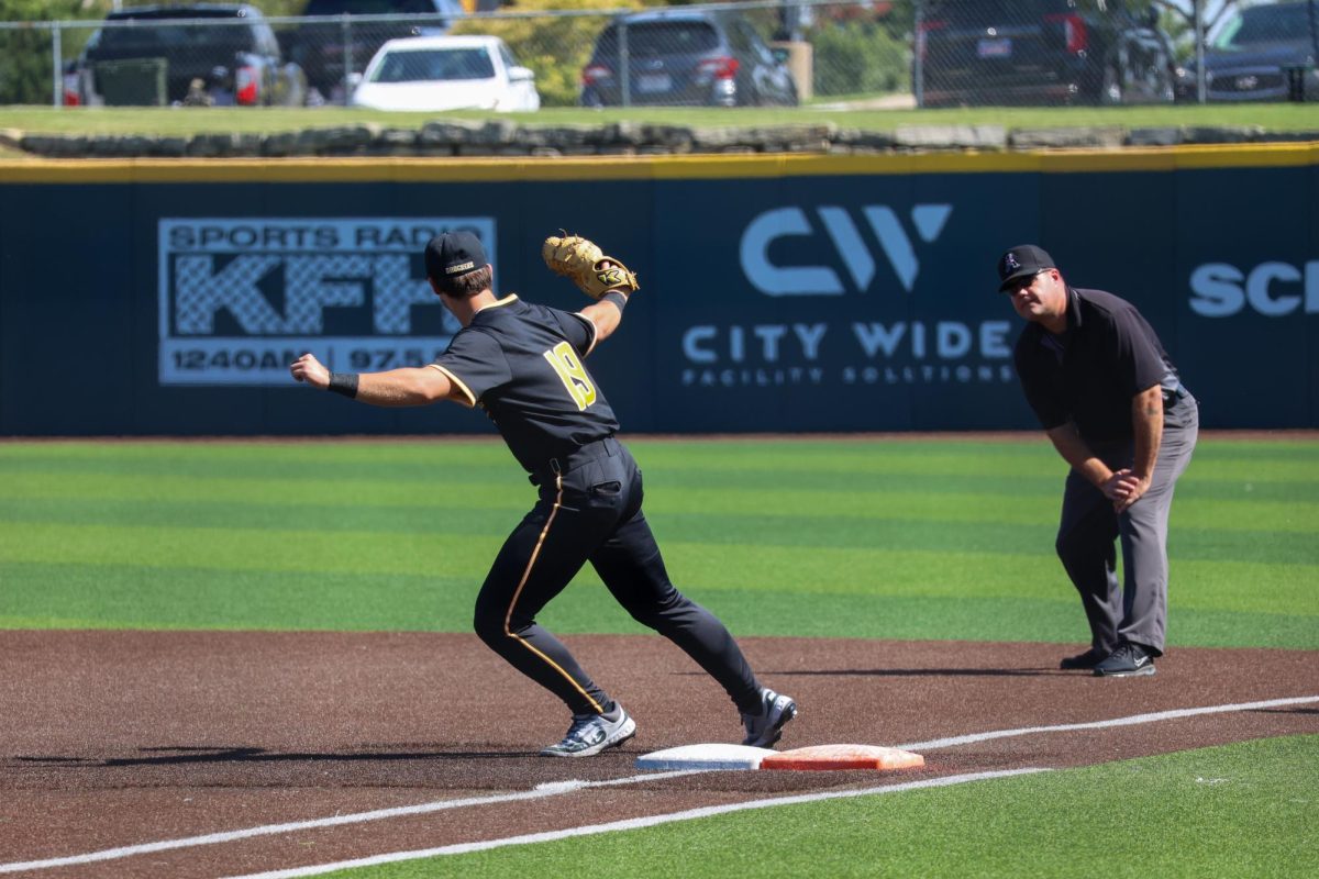 Junior Jack Quick (19) shows the ball to the umpire on Saturday, Sept. 27, 2025, at Eck Stadium in Wichita, Kansas. Quick is one of 31 newcomers on Wichita State's baseball team.