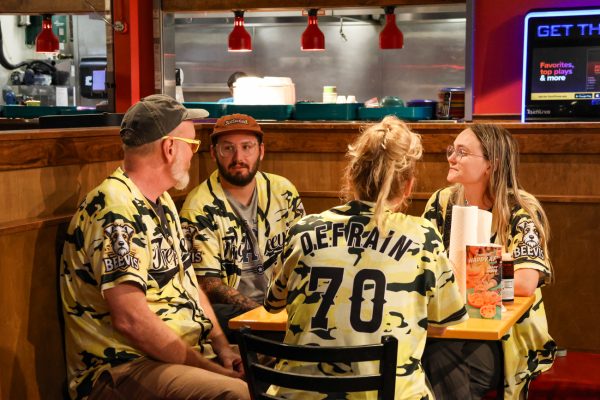Beevis team members contemplate their answers during Fuzzy's trivia night on Sept. 22. Fuzzy's Tacos in Braeburn Square hosts trivia every Monday night at 7 p.m.