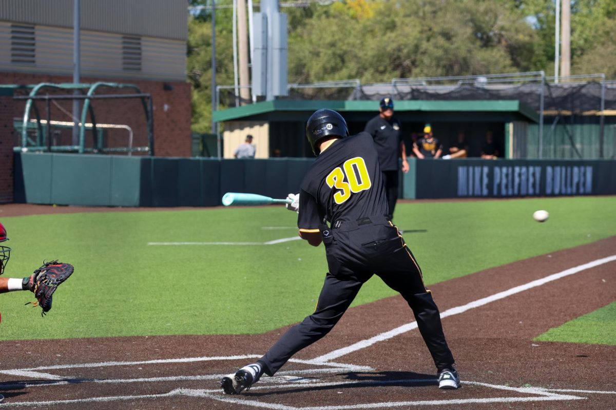 Junior Anthony Cepeda (30) swings at the ball during a game against Nebraska on Saturday, Sept. 27, 2025, at Eck Stadium in Wichita, Kansas. Cepeda hit .349 last season at Feather River Community College.