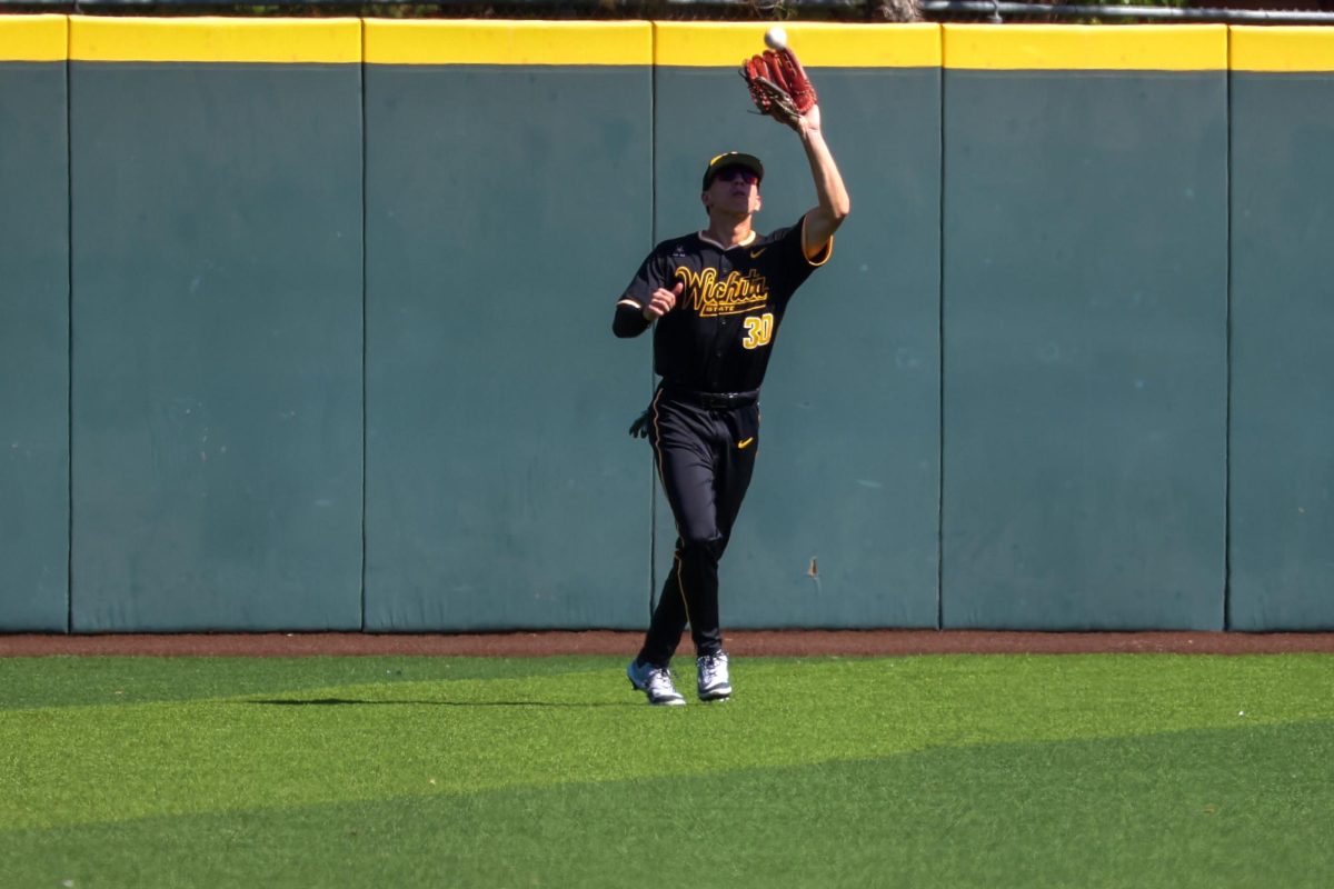 Junior Anthony Cepeda (30) reaches his glove up to make a catch against Nebraska on Saturday, Sept. 27, 2025, at Eck Stadium in Wichita, Kansas. Cepeda is a transfer from Feather River Community College.