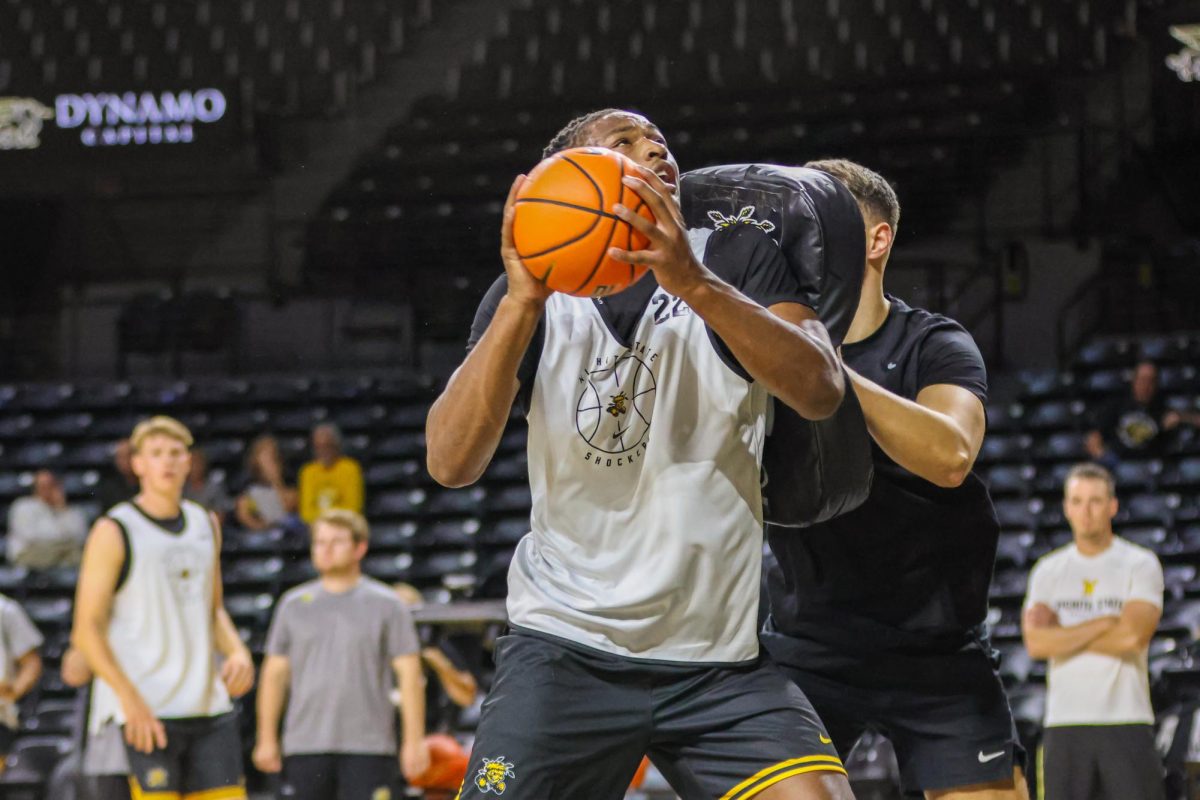Center Noah Hill practices shooting with contact during an open practice on Sept. 18. Hill attended Sunrise Christian Academy in Wichita when he was in high school.