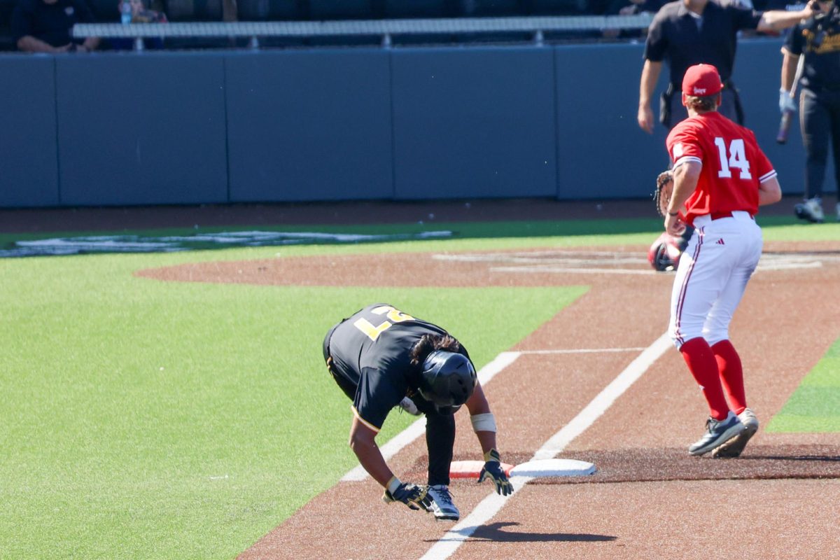 Senior Jacob Gutierrez (27) stumbles after reaching first base against Nebraska on Saturday, Sept. 27, 2025, at Eck Stadium in Wichita, Kansas. Gutierrez played at Lubbock Christian last season, a Division II college in Lubbock, Texas.