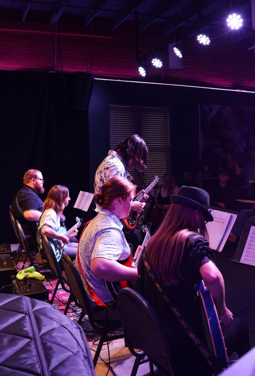Sophomore Adrian Torres plays a solo during Wichita State's Guitar Ensemble set. The ensemble played a quick set of just three songs.