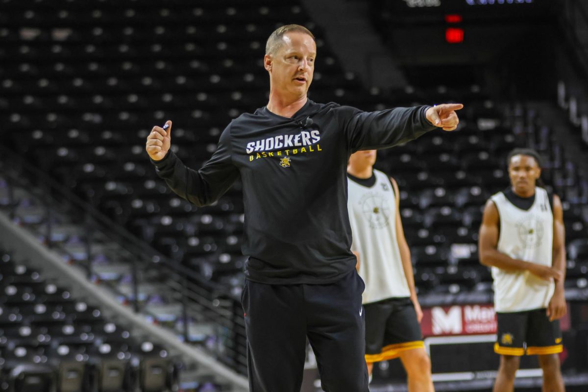 Head coach Paul Mills directs traffic during an open practice on Sept. 18. The 2025-26 season will be Mills' third year on staff.